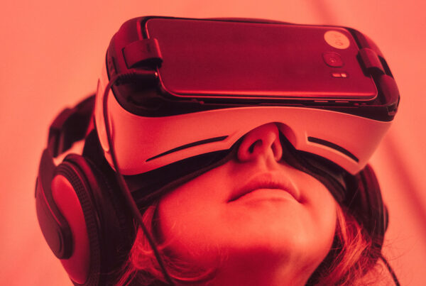 A person wearing headphones and using a virtual reality device.