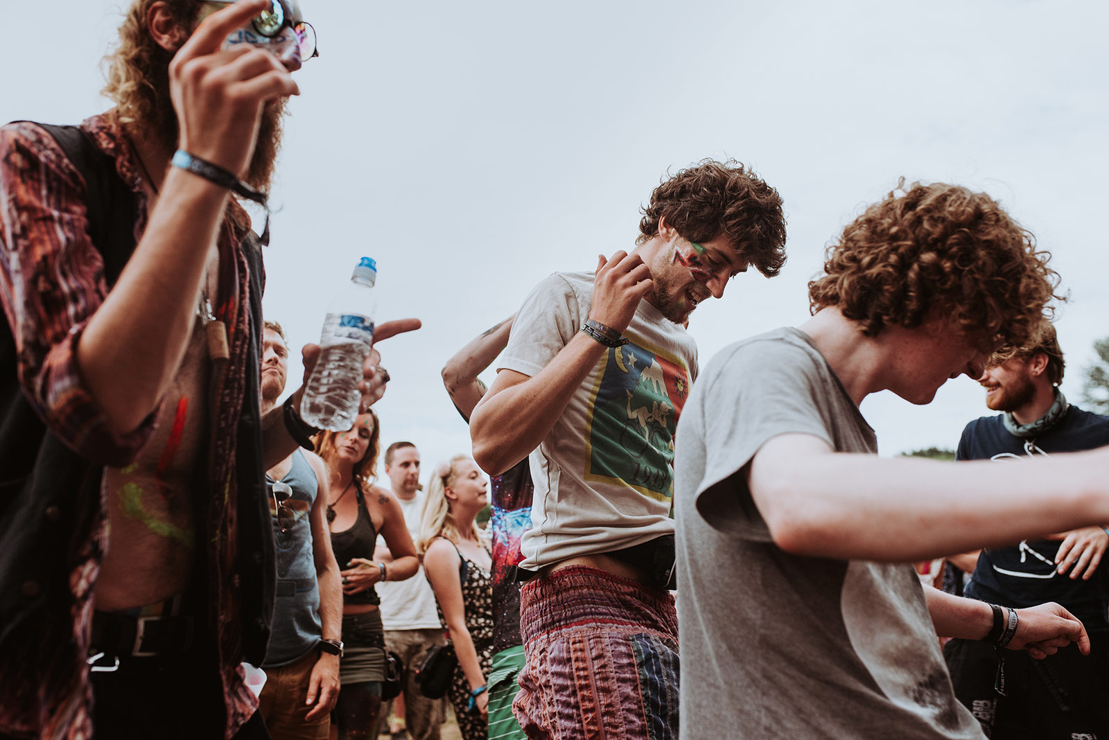 A group of people standing around each other.
