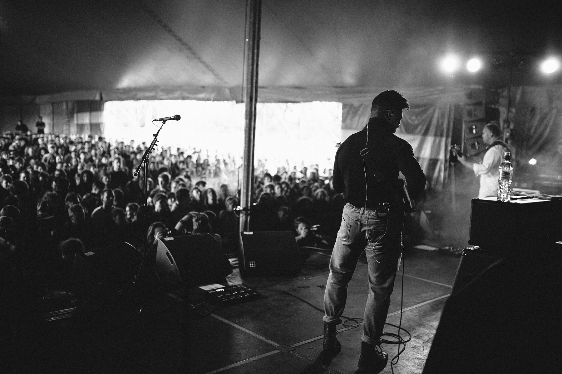 A man standing on stage with a microphone.