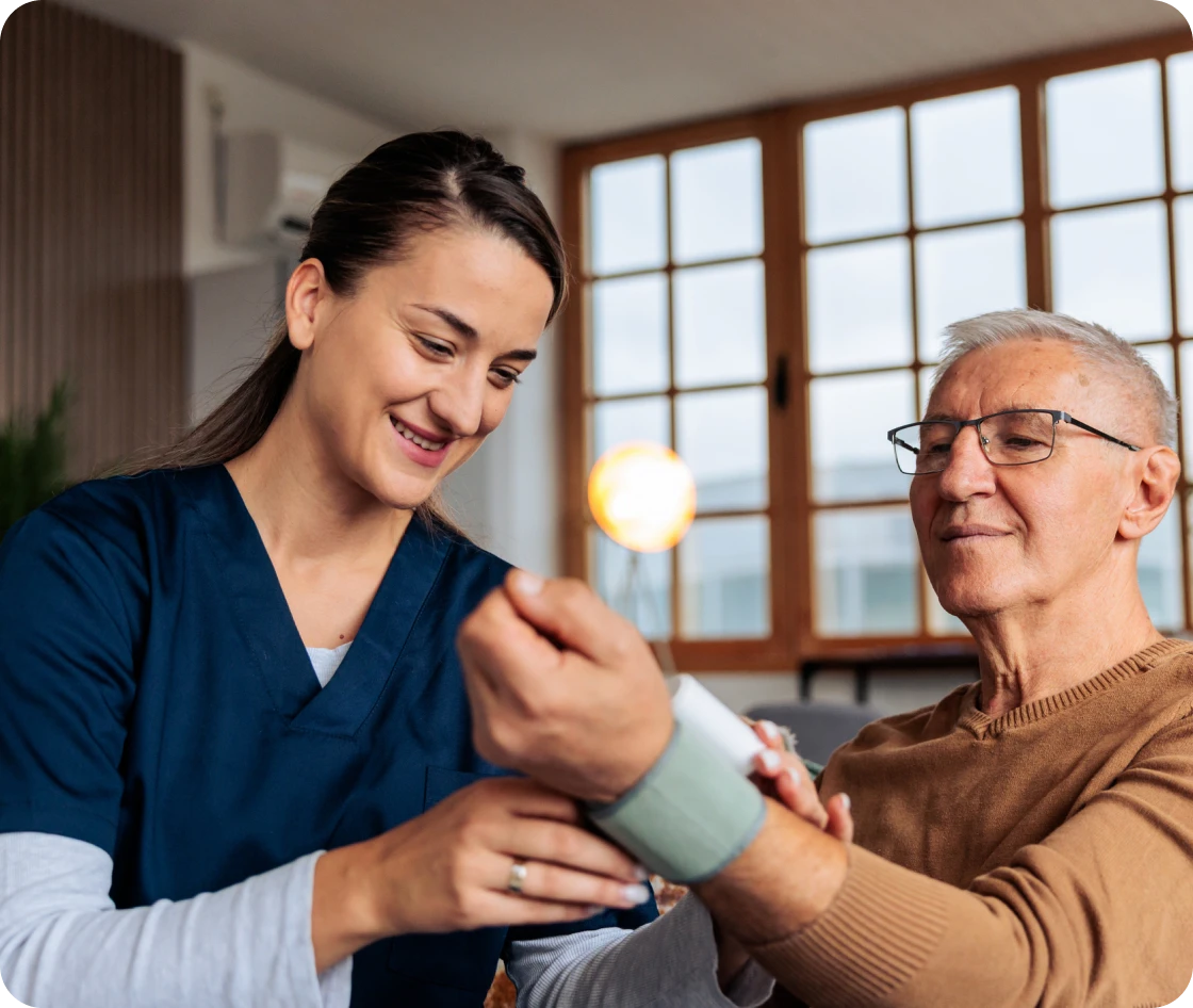Nurse taking patient's blood pressure