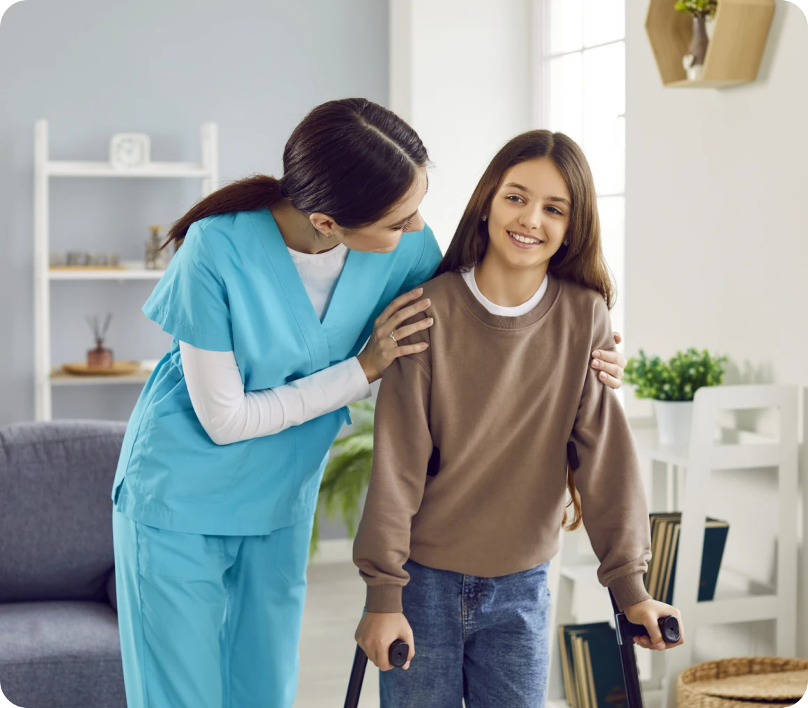 Nurse assisting young girl with crutches